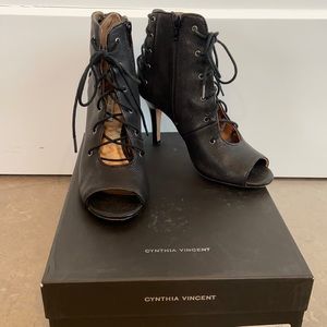 Black lace-up front, open toe booties